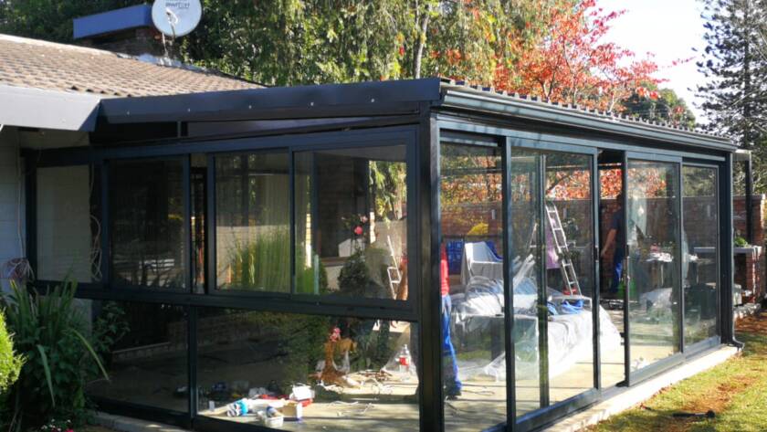 Glass patio enclosure installation by Truhome LLC PA as part of home improvement services in Mount Pleasant.
