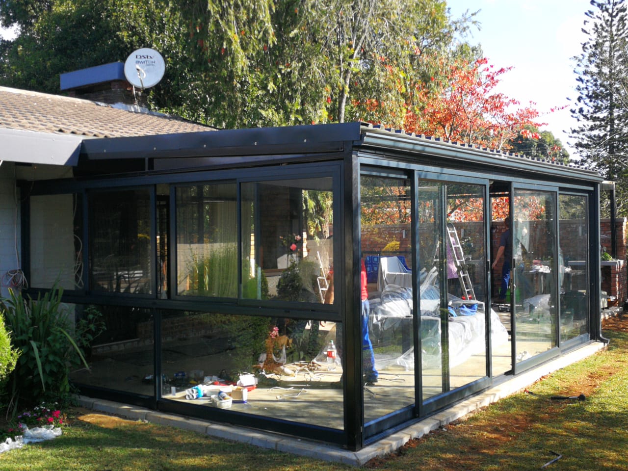 Glass patio enclosure installation by Truhome LLC PA as part of home improvement services in Mount Pleasant.