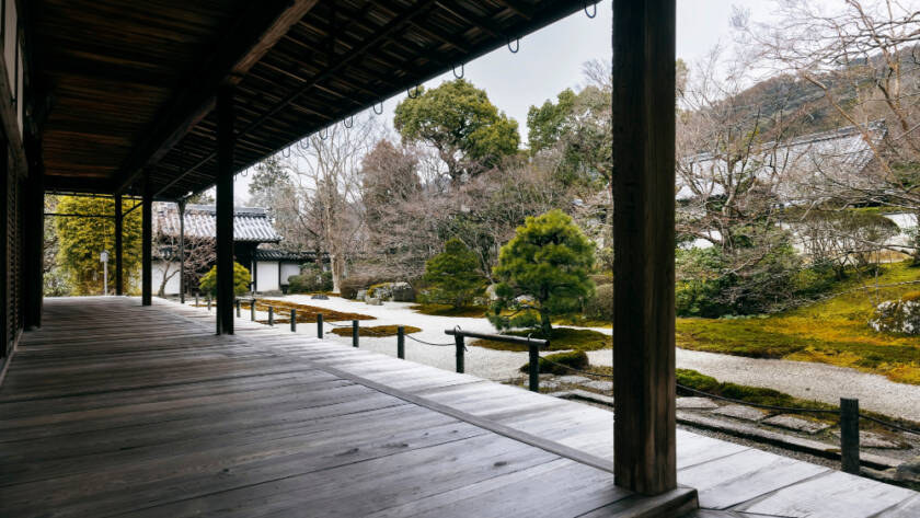 Traditional wooden porch overlooking a serene Japanese garden, highlighting the craftsmanship and attention to detail often featured in quality home improvement services.